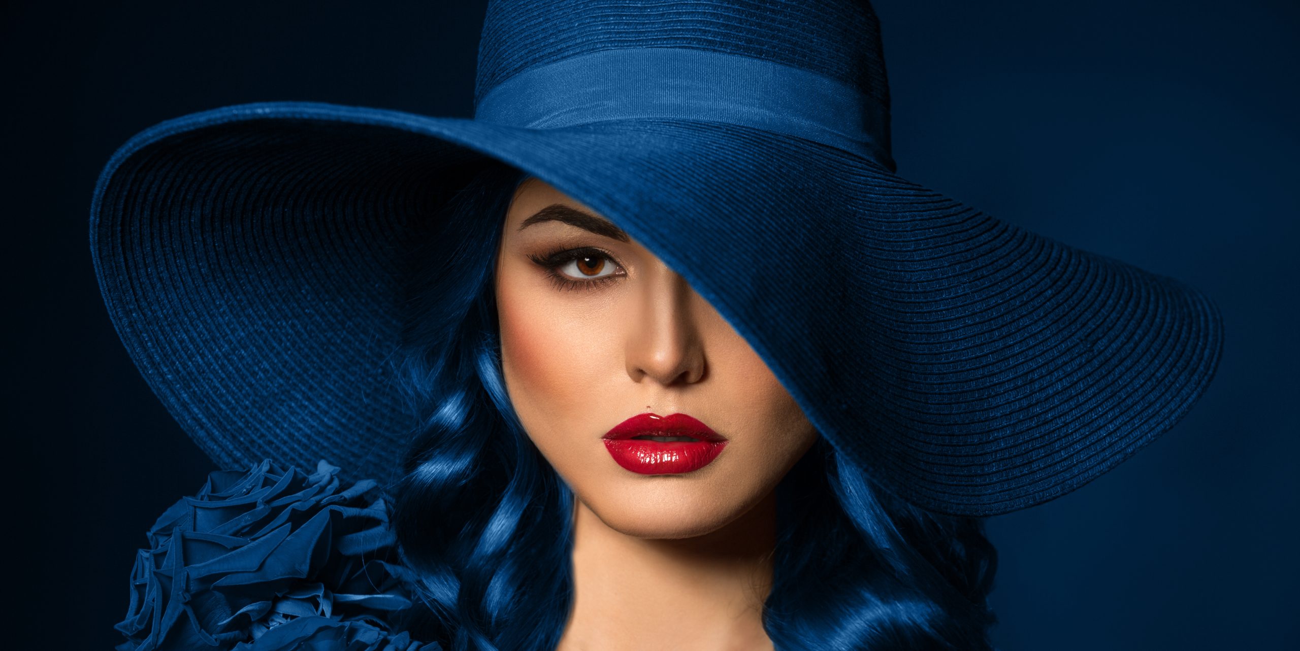Portrait of a woman with blue rose corsage