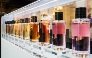 row of perfumes on a shelf